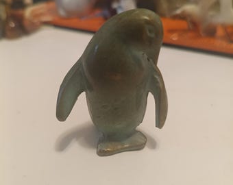 Small solid bronze pinguin figurine.