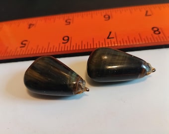 Matching blue tiger eye pendants.