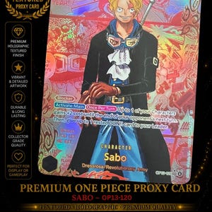 May include: A premium textured proxy card featuring Sabo from One Piece. The card has vibrant manga-style artwork, a holographic finish, and the text "Sabo" and "OP13-120". The card is a collector's item.
