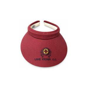 May include: A maroon sun visor featuring an embroidered circular emblem with a yellow and red center, flanked by two dark blue stylized wings. Below the emblem, the text LAKE KIOWA C.C. is embroidered in dark blue thread. The interior band is white.