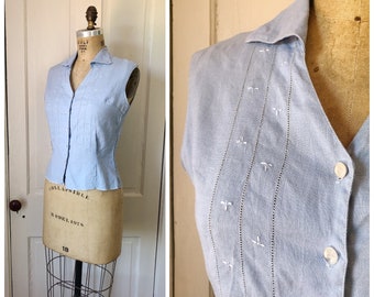 Passing Clouds 1950s Sleeveless Blue Linen Blouse with Embroidery