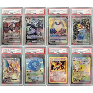 May include: Eight Pokemon trading cards in protective cases. The cards feature various characters and designs, including Charizard, Mew, and Pikachu. Each card is graded and labeled with the set name and a grade of 10.