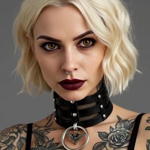 May include: A woman with blonde hair and dark lipstick wears a black leather choker necklace with a silver ring pendant. The pendant features a moth design. The woman has tattoos of roses on her chest and arms.