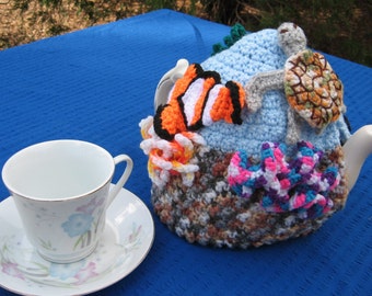 Under the tea coral reef tea cosy. Made to order, your choice of undersea creatures decorating it.