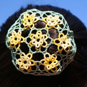 An original spring flowers PDF pattern for a tatted hair bun cover.