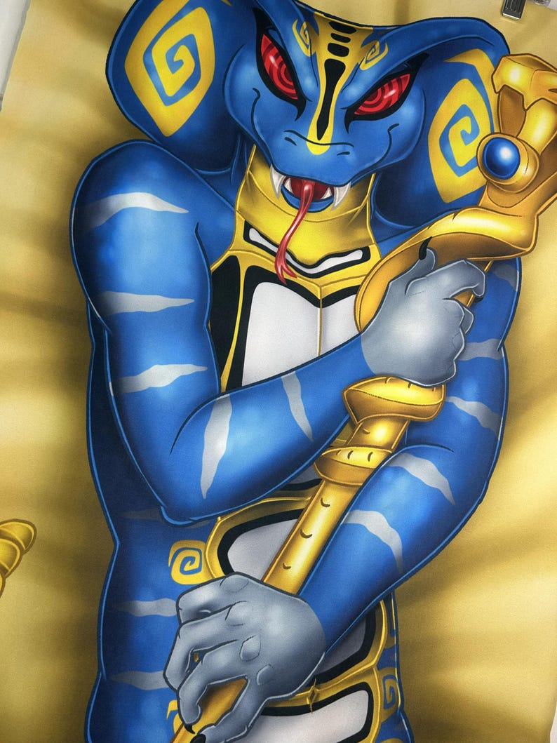 May include: A blue anthropomorphic cobra character with yellow and silver accents, holding a gold staff with a blue gem. The cobra has red eyes and a forked tongue. The background is a light yellow color.