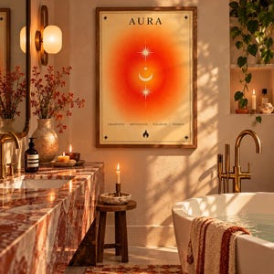 May include: A rectangular wall art print in a wooden frame featuring the word AURA at the top, a central orange and red gradient aura, sun and moon symbols, and the words CREATIVITY, MOTIVATION, PLEASURE, ENERGY with a flame icon below.