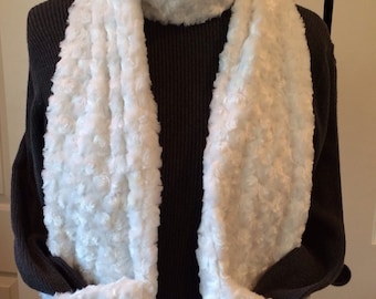 Cozy swirl faux fur pocket scarf will keep you and your hands warm too.