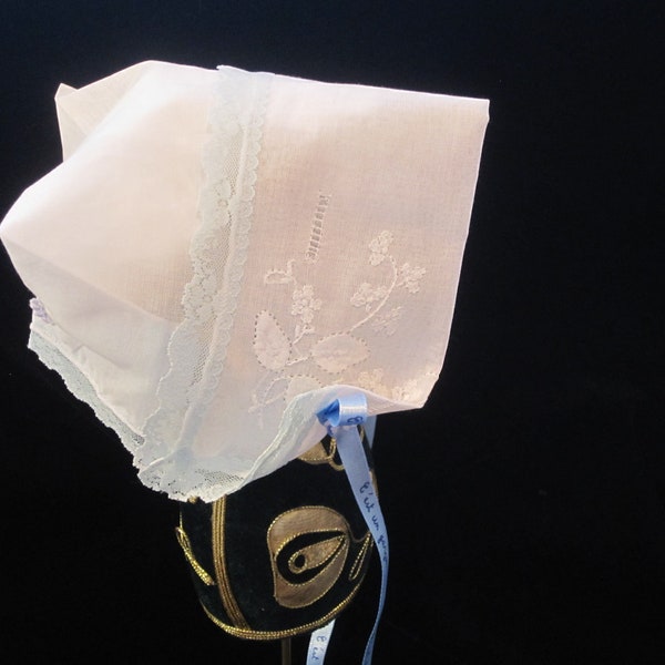 Hanky Bonnet, trimmed in blue lace,  and satin ribbon from Paris announcing "It's a boy" in French.  A special  heirloom for Baby Boy.