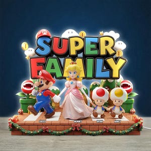 May include: A decorative display featuring Mario, Princess Peach, and two Toads standing on a brick platform. The text SUPER FAMILY is displayed in large, colorful letters above the characters. The base is decorated with a green garland and red bows.