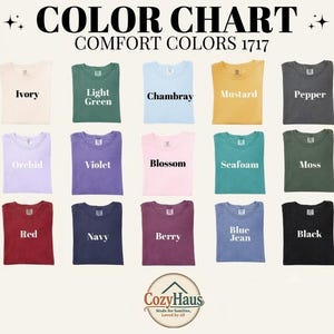 May include: A color chart for Comfort Colors 1717 t-shirts featuring twenty-one fabric swatches in various shades including white, ivory, light green, chambray, mustard, pepper, yam, espresso, orchid, violet, blossom, seafoam, moss, blue spruce, crimson, red, navy, berry, blue jean, black, and light grey.