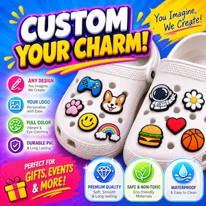 May include: Two white foam clogs decorated with various colorful PVC charms including a blue game controller, a dog face, a pink paw print, a yellow smiley face, a rainbow, an astronaut, a white flower, a burger, a red heart, and a basketball.