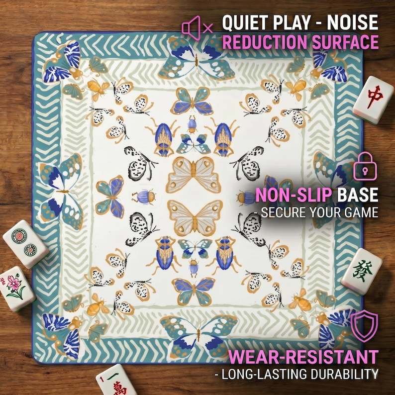 Close‑up of the butterfly insect mahjong table mat on a wooden table, with graphics highlighting the quiet noise‑reduction surface, non‑slip base and wear‑resistant features.