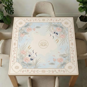 Dining table with beige chairs and plants, topped with the crane and lotus mahjong table mat, showing the full elegant water‑garden design.