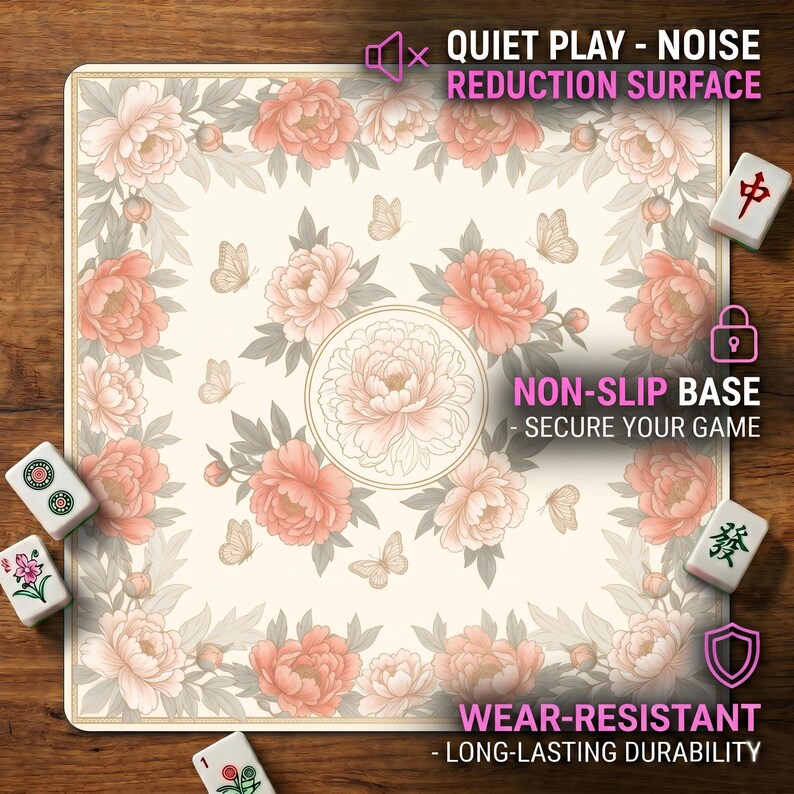 Close‑up of the ivory peony mahjong mat on a wooden table with overlay text highlighting the noise‑reduction surface, non‑slip base and wear‑resistant durability.