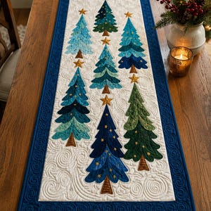 May include: A rectangular quilted table runner featuring a white background with swirling stitched patterns and seven appliqued Christmas trees in shades of blue, teal, and green. Each tree is topped with a gold star and has a brown trunk.