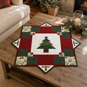 May include: A star-shaped quilted table topper featuring a central white square with a green Christmas tree and a red star topper. The design includes alternating dark red and dark green fabric blocks, accented with holly and berry patterns.