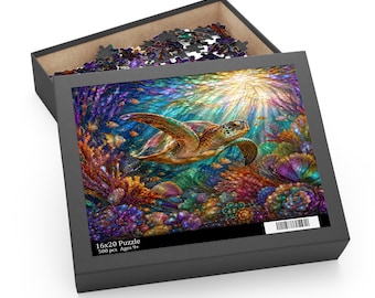 May include: A 500-piece jigsaw puzzle in a black box featuring a vibrant underwater scene with a sea turtle swimming among colorful coral reefs and fish. The box lid displays the artwork and text 16x20 Puzzle 500 pcs Ages 9+.