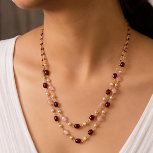 Set meerlaagse ketting en oorbellen met kralen