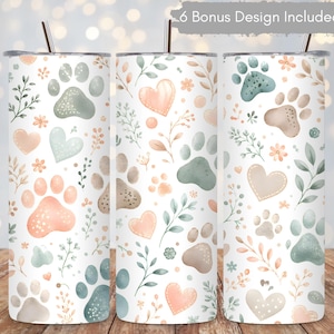 May include: Three cylindrical tumblers with straws, featuring a repeating pattern of watercolor paw prints, hearts, and leafy branches in soft shades of sage green, peach, and beige on a white background. Text at the top reads 6 Bonus Design Included.