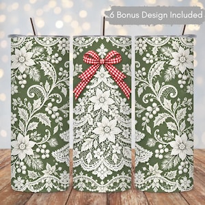 May include: A cylindrical tumbler with a straw, featuring a dark green background and a white lace pattern of poinsettias, holly leaves, and berries. The centre design includes a red and white checkered bow. Text reads 6 Bonus Design Included.