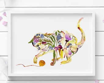 May include: A white framed print of a cat made from pressed flowers and leaves. The cat is playing with a ball of yarn.