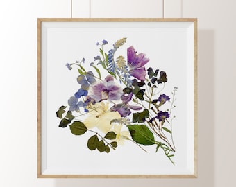 May include: A framed pressed flower art print featuring a bouquet of purple, blue, and yellow flowers. The flowers are arranged in a loose, natural style and are set against a white background.
