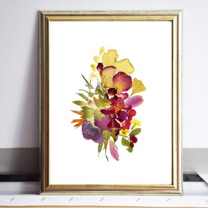 A framed print of a pressed flower arrangement. The flowers are arranged in a bouquet shape and include yellow, red, purple, and green tones. The flowers are pressed against a white background.