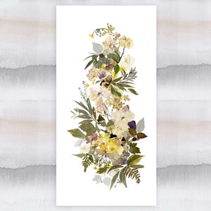 May include: A vertical arrangement of pressed flowers in shades of white, yellow, and green. The flowers are arranged in a cascading pattern, with the largest flowers at the top and the smallest flowers at the bottom.