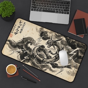 May include: A rectangular desk mat featuring a black and white ink-wash style illustration of a serpentine dragon creature surrounded by dark clouds and lightning bolts. The design includes Japanese text and a red stamp on a beige, parchment-like background.
