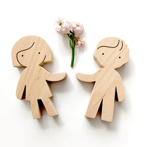 girl and boy wooden figures