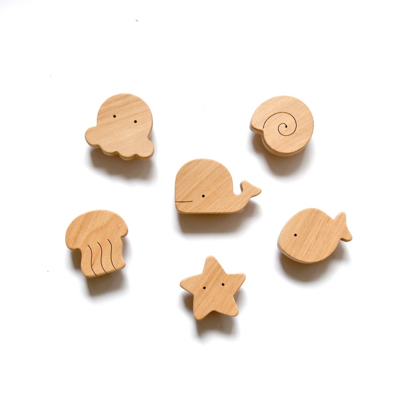 Ocean-themed nursery knobs for the dresser. Perfect for other kids' furniture drawers, and cabinet doors.
The set of 6 marine characters includes:
Octopus, Whale, Fish, Sea Star, Jellyfish, and Shell.