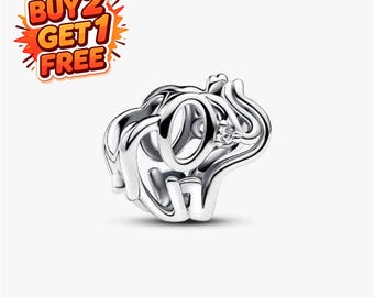 May include: A silver-toned metal charm bead shaped like an elephant with an openwork design. The elephant features a small, clear, round gemstone set into its side. The text BUY 2 GET 1 FREE is displayed in the upper left corner in orange and red.