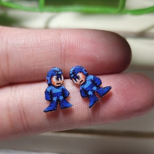 Mega Man pixel stud earrings.
