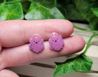 Purple space character stud earrings cartoon themed