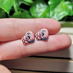 Issac stud earrings// Stainless steel, resin, plastic.