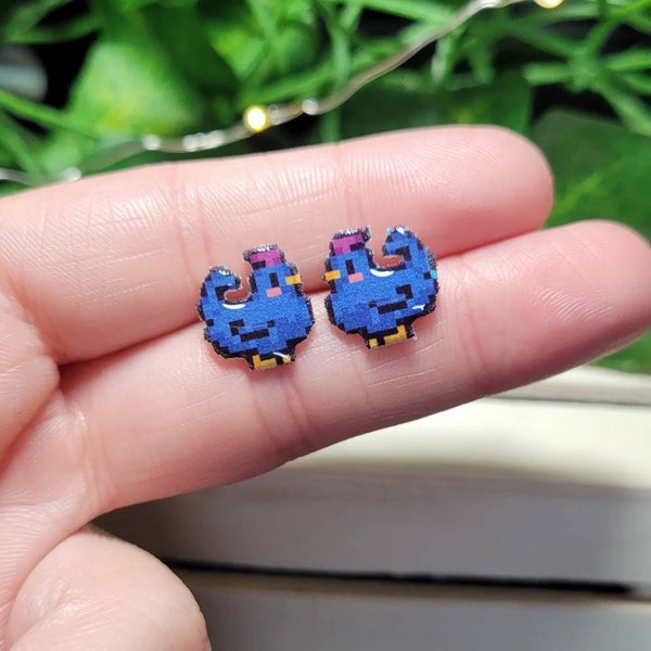 Stardew Valley blue chicken earrings.