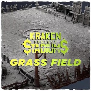 May include: A gray miniature tabletop gaming stadium field featuring a textured ground, wooden fence perimeter, and a central post. The text KRAKEN FANTASY STADIUMS GRASS FIELD is overlaid in bright yellow and green lettering across the center.