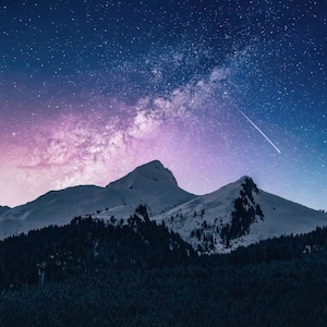 May include: A scenic landscape featuring snow-capped mountains under a starry night sky. The sky transitions from deep blue to purple, with a bright streak of a shooting star. Dark green trees line the base of the mountains.