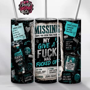 May include: A black stainless steel tumbler with a straw featuring a missing person poster design in teal and white text. The graphic includes phrases like 'My give a fuck has fucked off', 'Zero fucks given', and various checklist notes on a dark background.