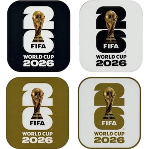 May include: A set of four square coasters featuring the FIFA World Cup 2026 logo. The design includes the number 26 with the gold World Cup trophy integrated into the digit, displayed in black, white, and gold color variations with text.