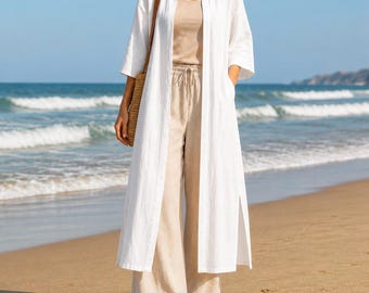 Giacca da donna bianca in misto lino a maniche lunghe, aperta sul davanti, ideale per l'autunno, stile boho rilassato, costiero, letterario, vintage, con spacco laterale.