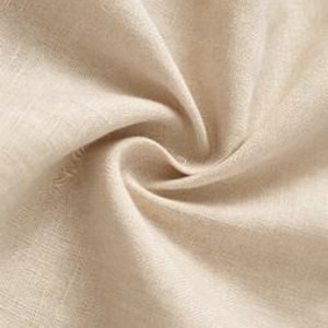 May include: A close-up view of beige linen fabric featuring a visible woven texture with natural fibers. The material is draped in soft, flowing folds, creating light and shadow across the surface. A small rectangular tag is visible in the corner.