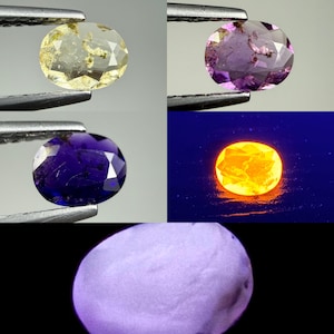 May include: A composite image showing an oval-cut gemstone in various states: pale yellow, light purple, and deep blue under normal light, a bright glowing orange under ultraviolet light, and a solid light purple opaque stone on a black background.