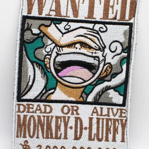 May include: A rectangular embroidered patch featuring a Wanted poster design. The text reads WANTED, DEAD OR ALIVE, MONKEY D LUFFY, and 3 000 000 000. The central graphic depicts a laughing character with white hair and smoke, rendered in brown, teal, and white.