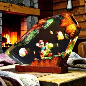 May include: A decorative resin and wood lamp featuring a miniature scene with Mario riding Yoshi, a Boo ghost, a question mark block, and gold coins. The piece is set on a rectangular wooden base with a dark, polished finish and internal lighting.