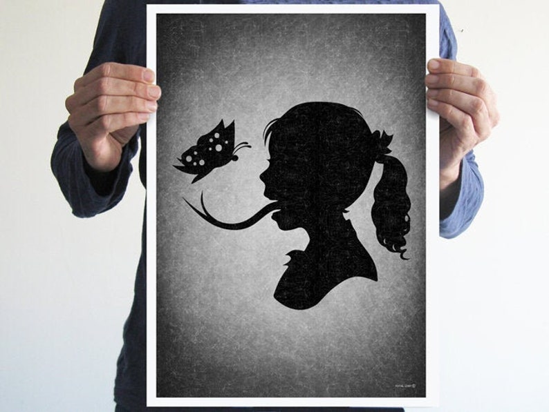 May include: Black and white silhouette of a girl with long hair, her tongue extended to touch a butterfly with black and white spots.
