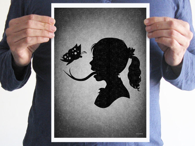 May include: Black and white silhouette print of a girl with a butterfly on her tongue. The background is a textured gray.