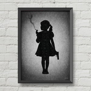 May include: Black and white framed print of a silhouette of a girl holding a cigarette and a gun. The background is a textured gray.