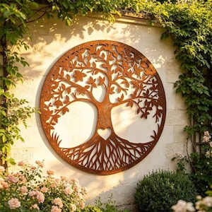 May include: A circular wall art piece made of rusted metal featuring a detailed tree of life design. The artwork displays intricate branches with leaves and a root system that forms a circular border, with a small heart cutout at the center.